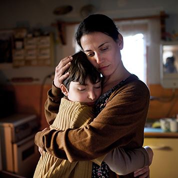mother hugging her son